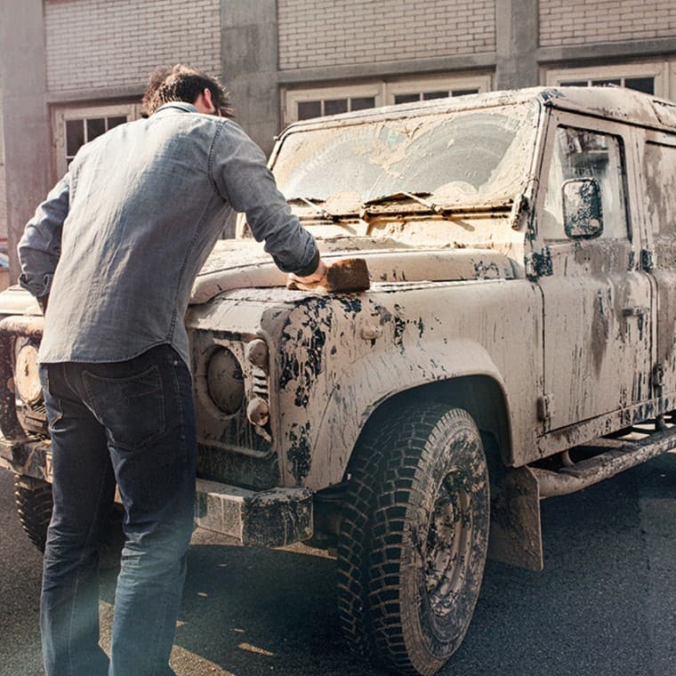 Man cleans a dirty car Man cleans a dirty car