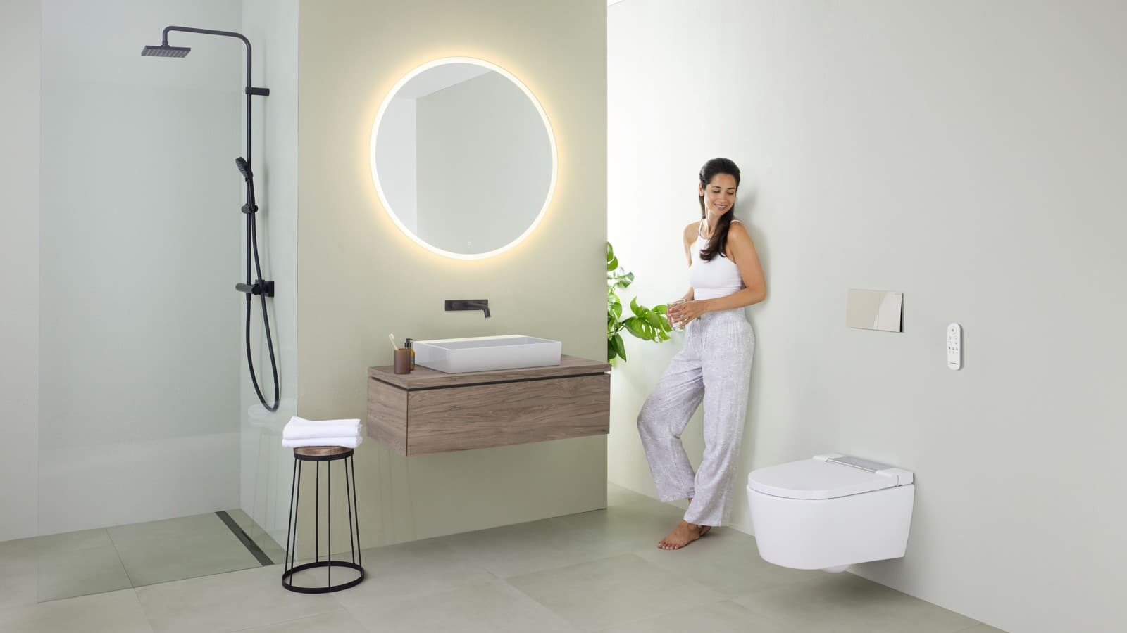 Woman in a minimalist bathroom Woman in a minimalist bathroom