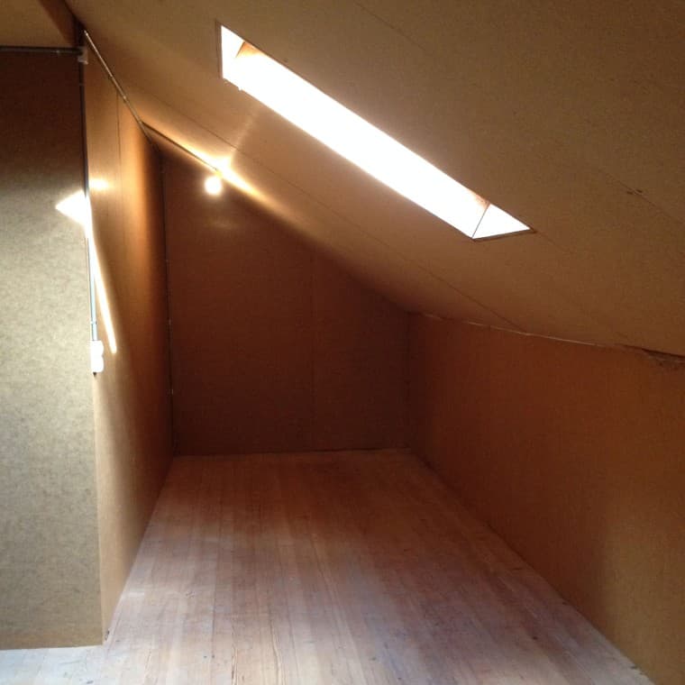 Small attic bathroom with a sloped ceiling prior to renovation Small attic bathroom with a sloped ceiling prior to renovation